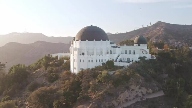 Aerial drone shot. Observatory Park Los Angeles. flying over Griffith Observatory. downtown Los Angeles skyline. California travel destination in America.