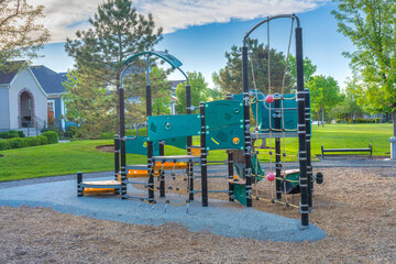 Fototapeta na wymiar Small public playground on a residential area at Daybreak, Utah