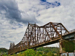 The Bellaire Bridge just south of Wheeling WV at 8th street Brentwood WVa crossing the Ohio River. Abandoned. It  is a privately owned closed Toll bridge. It is a cantilever truss style bridge.