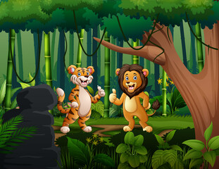 Naklejka premium Cute lion and tiger giving thumb up at the jungle