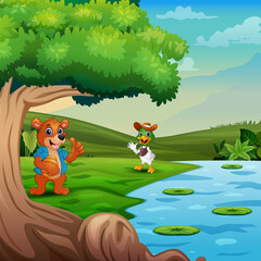 Obraz na płótnie Canvas Cartoon sun bear meeting a duck by the river