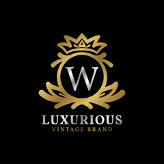 Fototapeta premium letter W with crown luxury crest for beauty care, salon, spa, fashion vector logo design