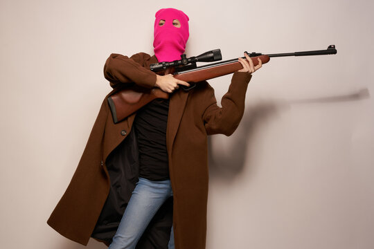 woman in pink mask danger crime fashion isolated background