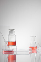 Scientist with chemical reaction in chemistry laboratory. close up of scientist making research in lab in white background , red water in test tube and blank space for advertising , front view