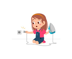 little girl curious to plug in electric iron to wall outlet