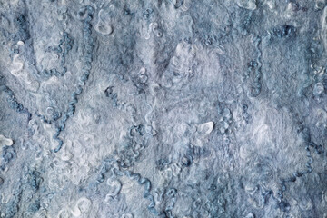 Fototapeta na wymiar background blue wool carpet close-up