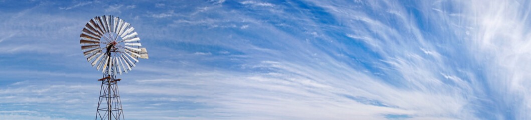 panorama of clouds and windmill