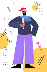 man in santa hat drinking champagne 2022 new year and christmas holidays celebration concept vertical