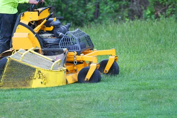 Deurstickers manual worker mowing the lawn © nd700