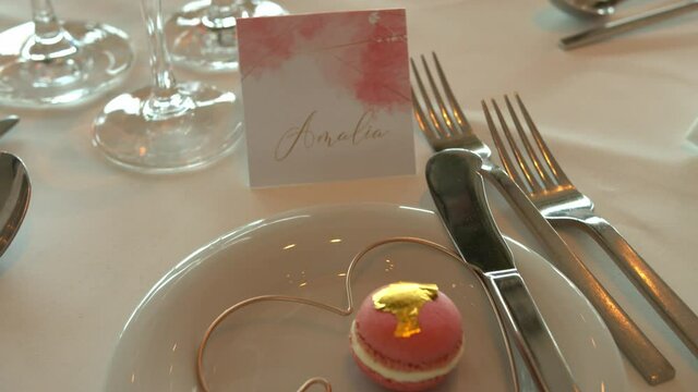 Wedding desert dinner plate with beautiful gold and pink design. Slow motion.