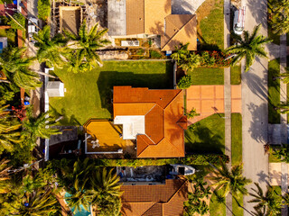 Aerial direct overhead real estate photo of a single family house with big backyard