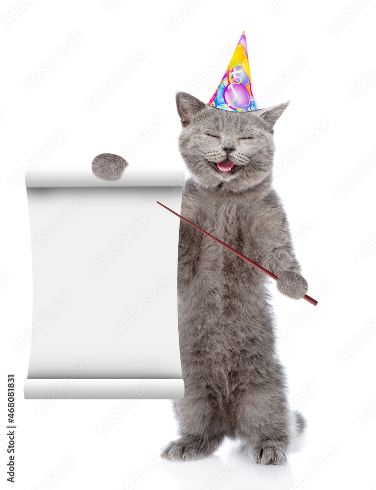 Poster happy cat wearing birthday cap points on empty list. isolated on white background