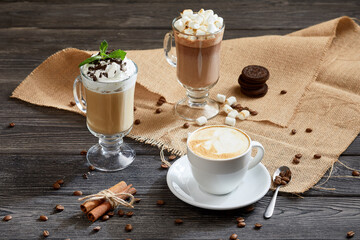 different types of coffee drinks over wooden background
