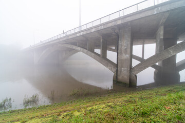 under the bridge with fog
