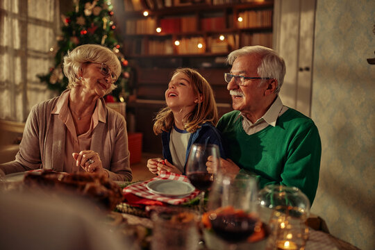 Family having lunch together at a table during Christmas time