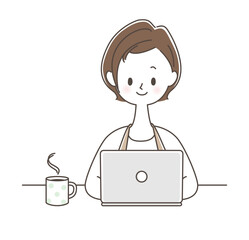 コーヒーを飲みながらパソコンをする女性
