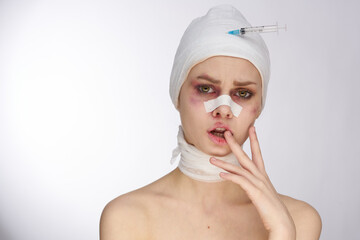 emotional woman plastic surgery operation bare shoulders light background