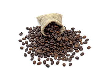 Heap of roasted coffee beans and hemp bag. isolated on a white background.