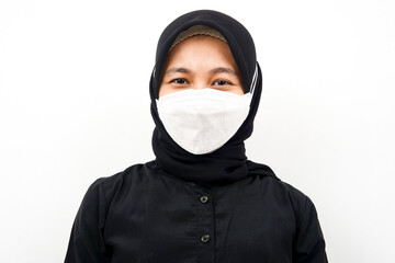 Closeup of beautiful young Muslim woman wearing white mask, corona, covid-19, isolated