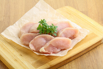 Raw chicken breast slices for cooking