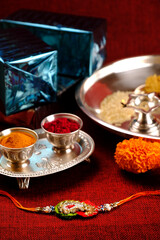 Indian festival: Raksha bandhan Raakhi with sweets gifts flowers and diya, Raksha Bandhan (Bond of protection and care), Indian festival of sisters and brothers.