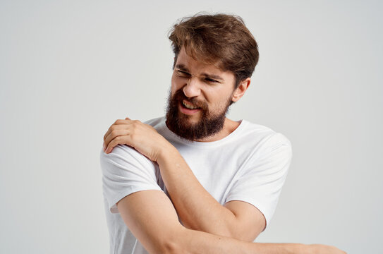 bearded man holding neck arthritis health problems isolated background