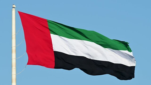 Slowmotion: The Flag of the United Arab Emirates waving in the air, The national symbol of The United Arab Emirates
