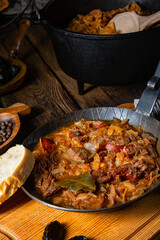 Polish bigos cooked according to an old recipe with wine and plum