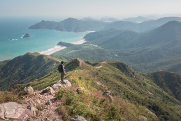 Amazing view of Man standing of Sharp Peak, Sai Kung, Hong Kong.