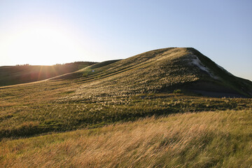 hills with grass landscape at sunset