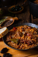 Polish bigos cooked according to an old recipe with wine and plum