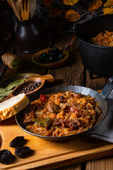 Polish bigos cooked according to an old recipe with wine and plum