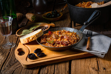 Polish bigos cooked according to an old recipe with wine and plum