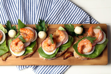 Homemade sandwiches with salad, eggs, radishes and shrimps