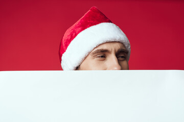 Cheerful man in a christmas white mockup poster studio posing