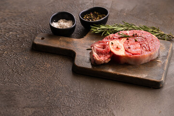Raw  osso buco meat  steak on wooden try.Copy space