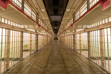 Brodway, the main corridor of the cellhouse dividing B and C Blocks of Alcatraz Prison at Alcatraz Island. - obrazy, fototapety, plakaty