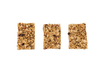 Granola bars with seeds, oat and rice flakes, dry berries, honey isolated on white. Healthy snack top view.