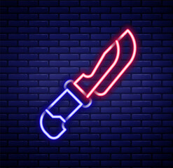 Glowing neon line Knife icon isolated on brick wall background. Cutlery symbol. Colorful outline concept. Vector