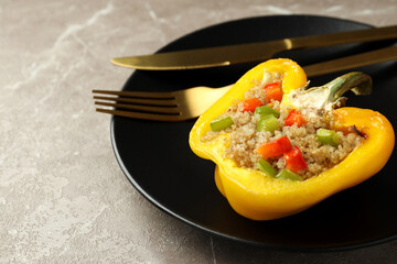 Concept of tasty food with stuffed pepper on gray textured background