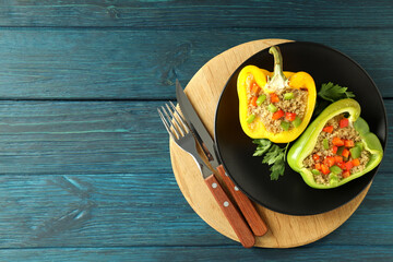 Concept of tasty food with ​stuffed pepper on wooden background