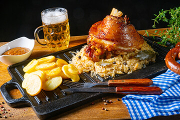 rustic pork knuckle with sauerkraut, sweet mustard and fried potatoes - obrazy, fototapety, plakaty