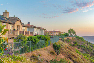 Fototapeta na wymiar Two-storey houses near the edge of a slope at San Diego, California