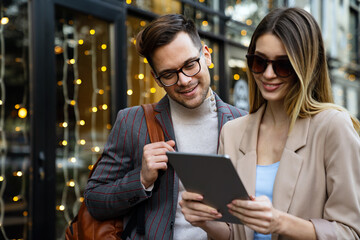 Fototapeta premium Portrait of successful business people working, talking together in urban background.