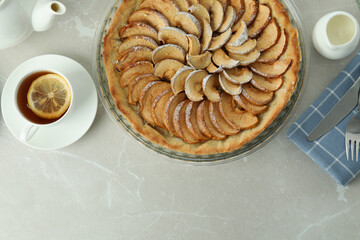 Concept of tasty food with apple pie on textured background