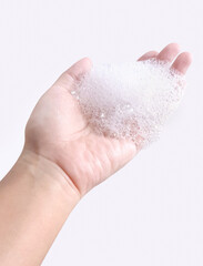 hand with soap bubbles foam