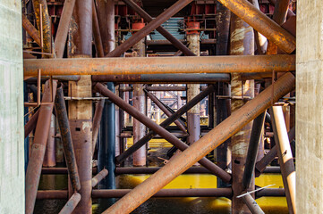 Fototapeta premium Reinforced concrete structure of the bridge under construction. Bridge over the Dnieper River in Kiev. Engineering structure. Building construction. Water crossing. Industry. Ukraine.