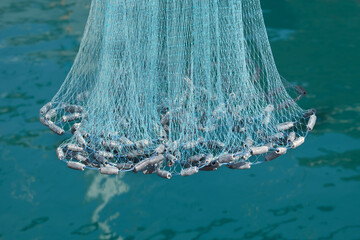 Fischernetz , Wurfnetz mit Senkblei - obrazy, fototapety, plakaty