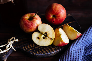 Red apples on a wooden table.