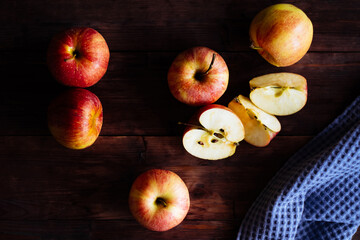 Red apples on a wooden table.